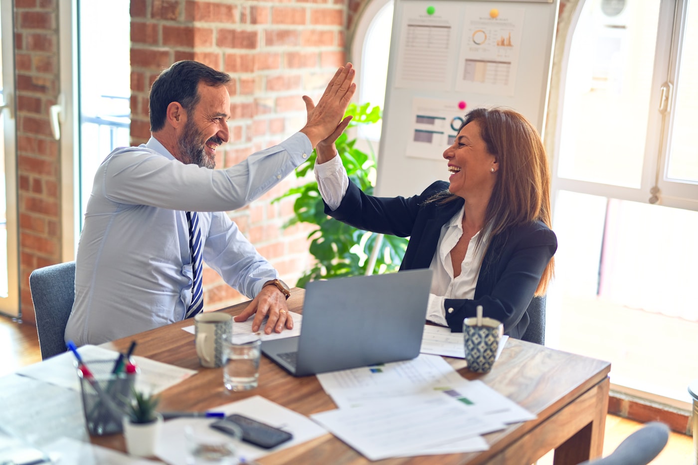 Investors celebrating a successful lending structure